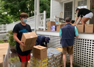 Volunteers unloading donated food boxes
